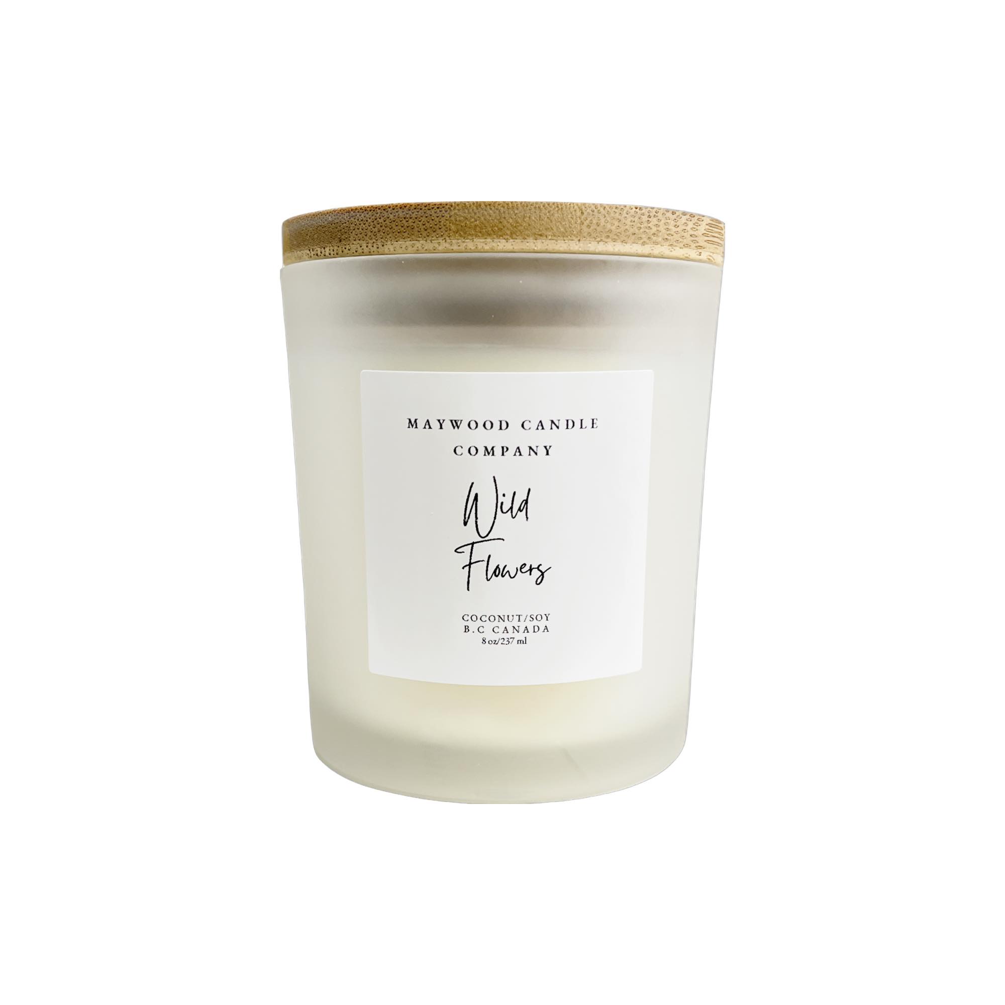 Maywood Candles with a variety of scented candles in glass jars, showcasing different colors and candle flames.