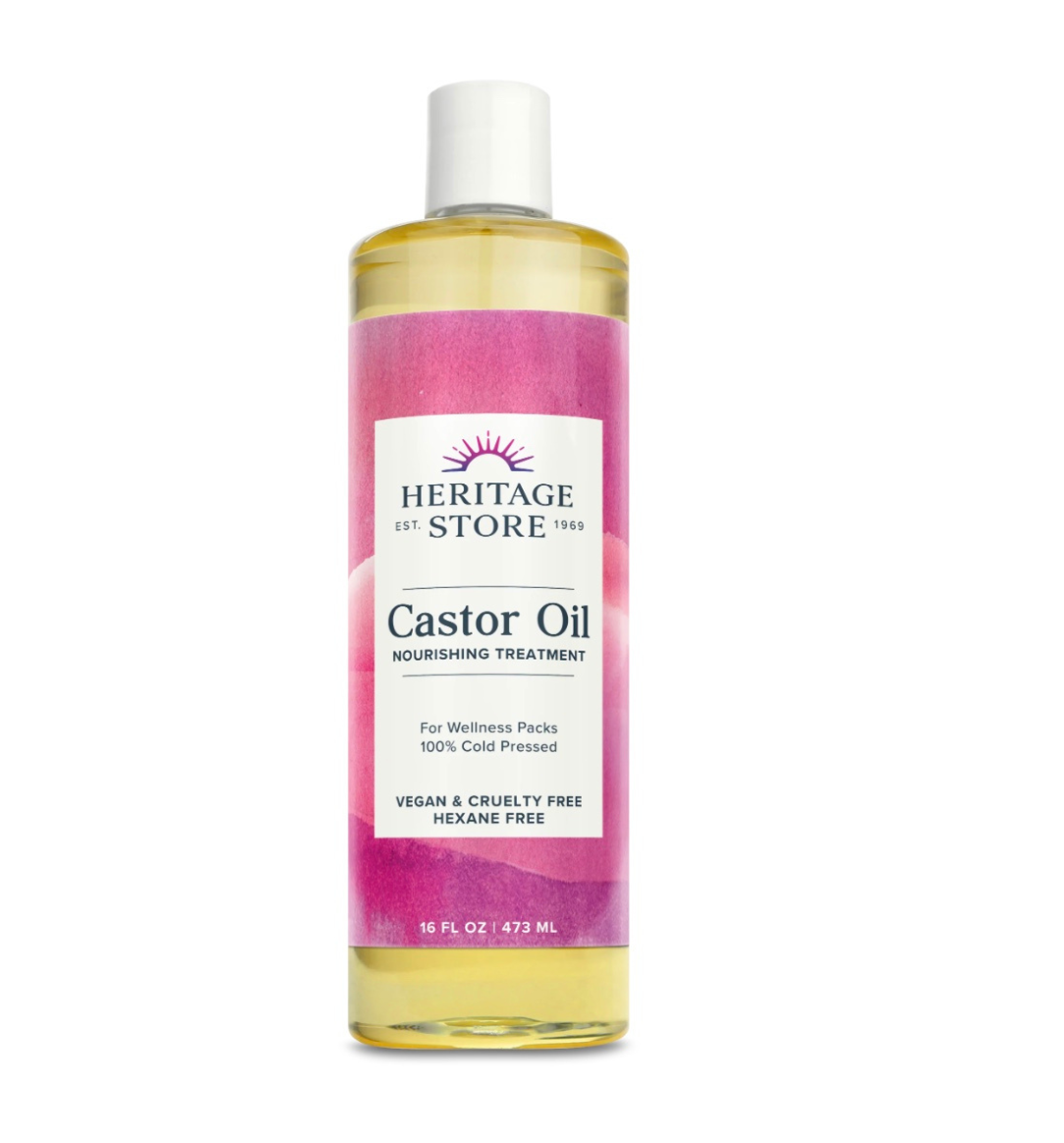Heritage Store organic castor oil bottle for skin, hair, and deep hydration, shown in a clear glass container with a white label.