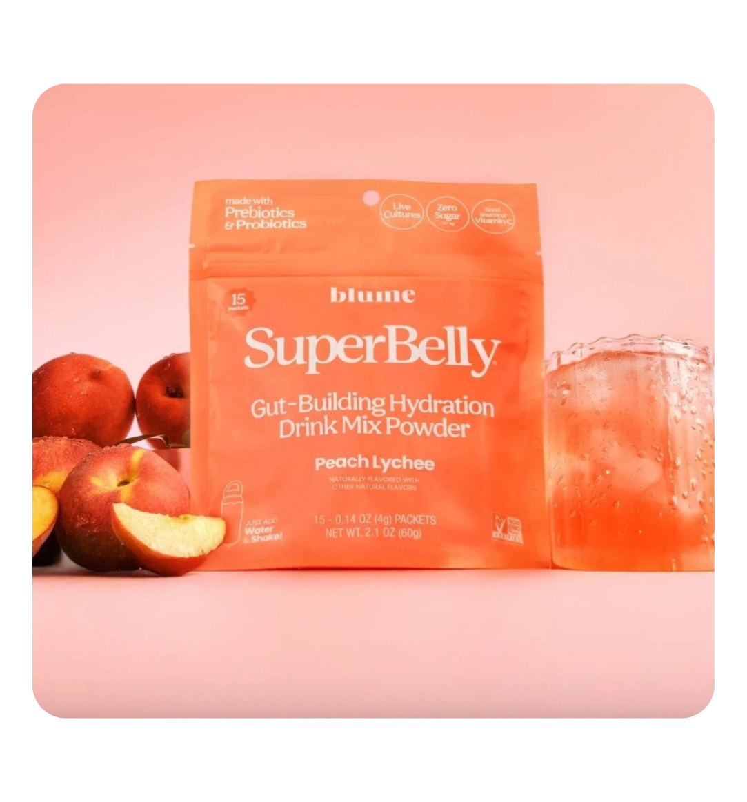 Blume SuperBelly Gut-Building Hydration Powder in a jar, featuring a scoop of powder and fresh fruits on a white background.