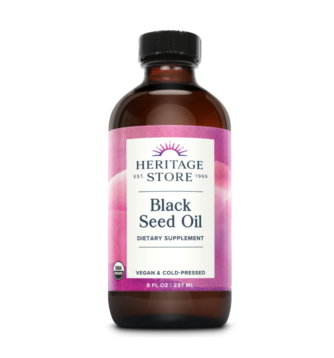 Heritage Store organic black seed oil bottle, showing dark glass container with label, used for immune, digestion, and skin support.