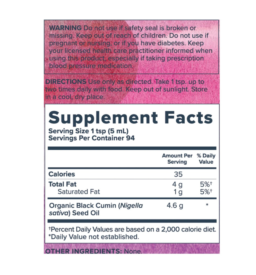 Organic Heritage Store Black Seed Oil bottle, showing dark liquid inside, used for immune support, digestion, and skin health.