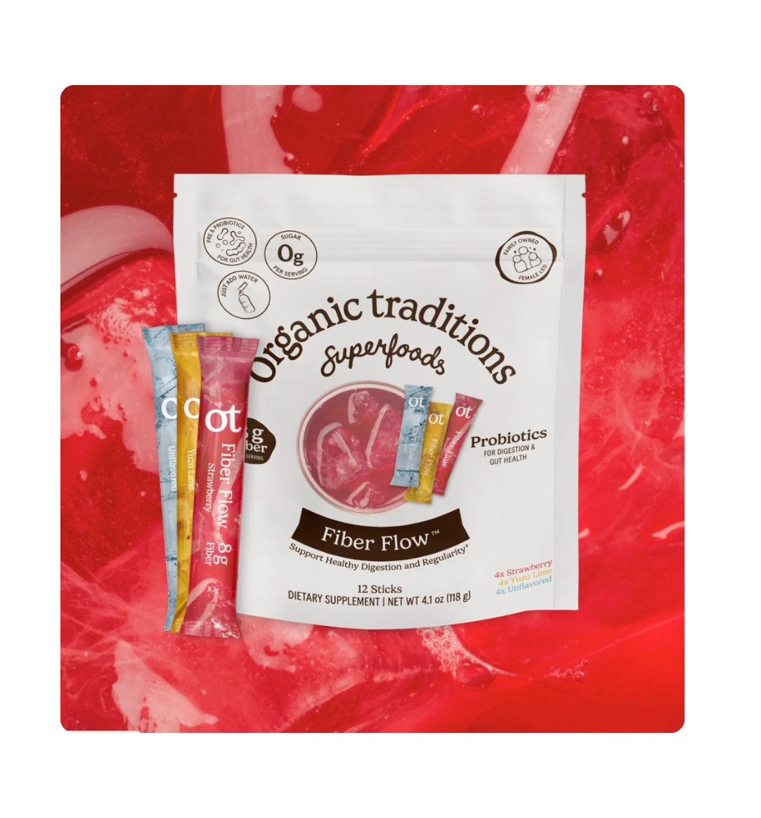 Organic Traditions Fiber Flow prebiotic fiber and probiotic supplement in a clear container with a scoop, designed for gut support.