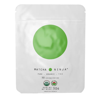 Smooth, vibrant green cold brew matcha from Matcha Ninja, showcasing a clear glass with frothy matcha drink topped with green tea powder.